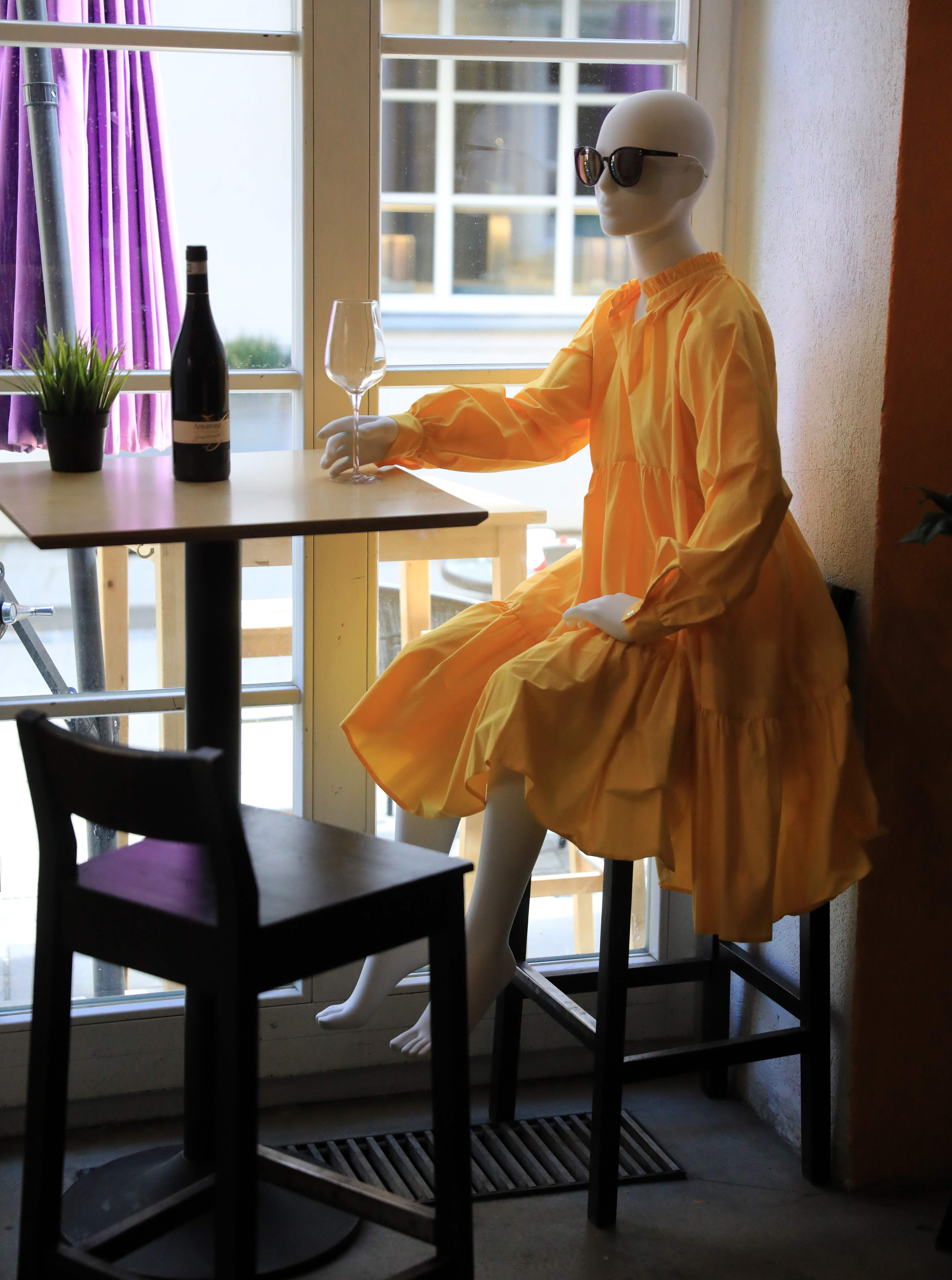  A mannequin provides social distancing at a restaurant in Vilnius, Lithuania