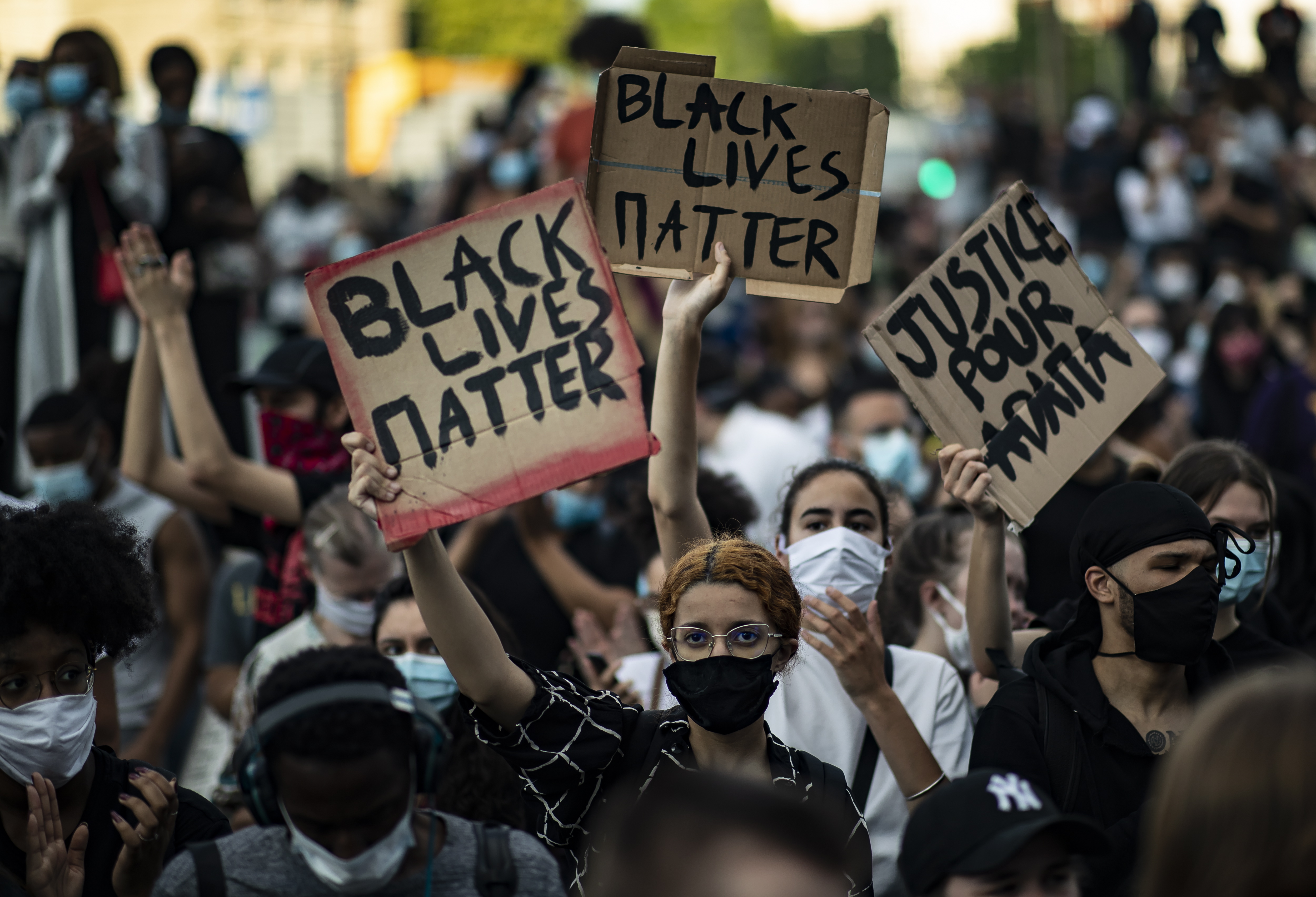  Parisians held signs demanding justice and paid homage to Adama Traore, a black Frenchman who died in similar circumstances