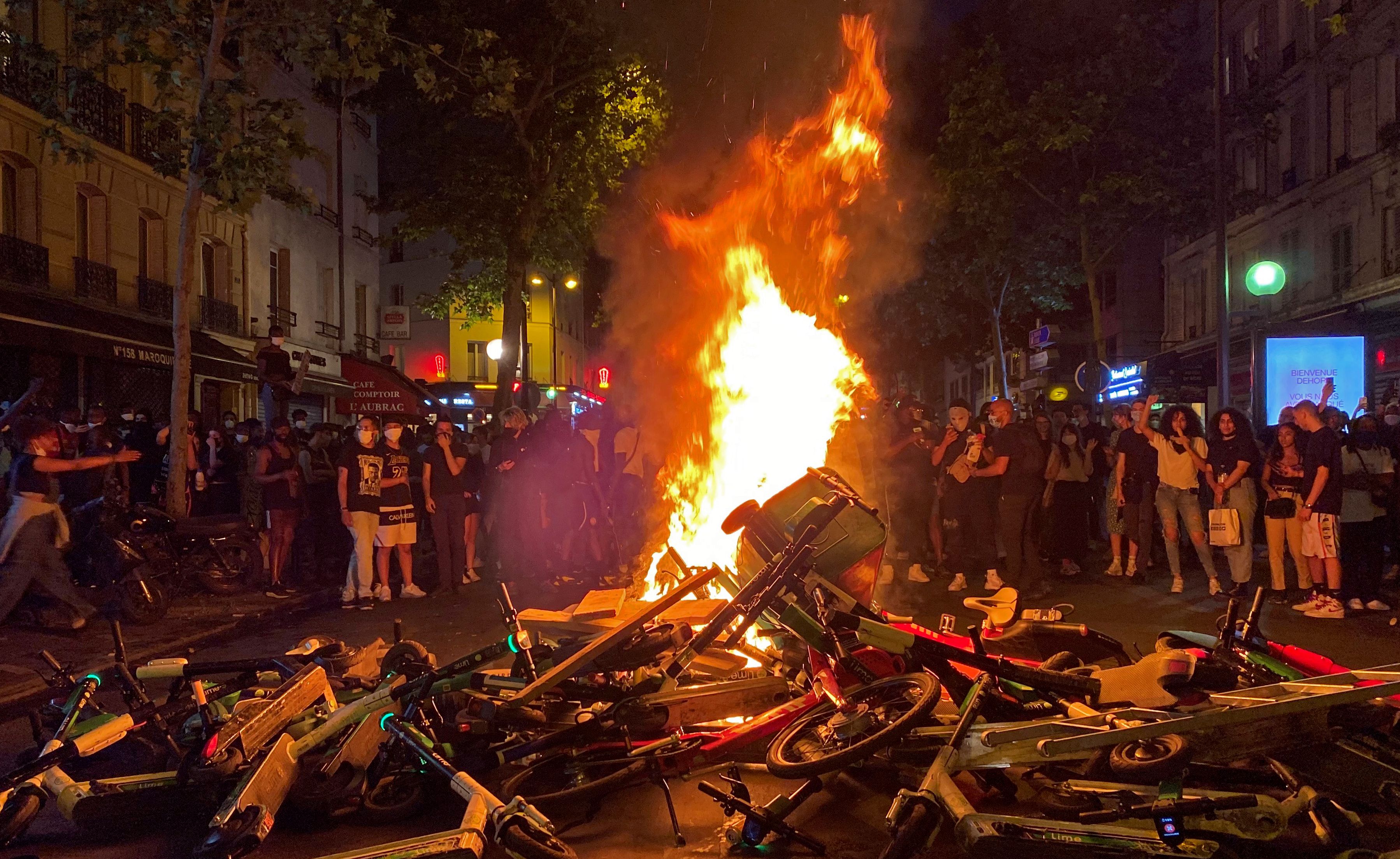  Protesters burn trash bins, scooters and bicycles on Paris streets