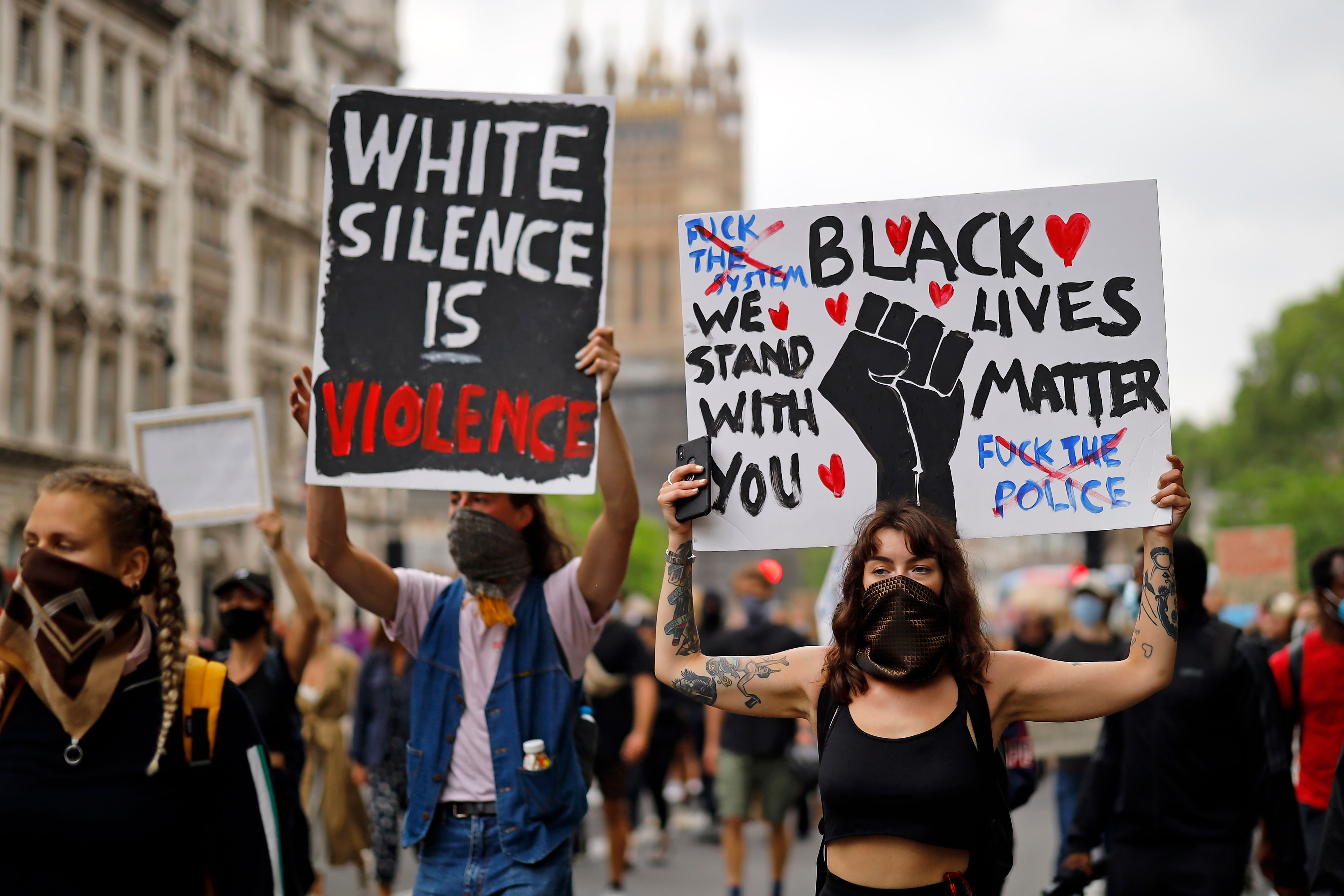  Londoners held signs with catchy slogans as they marched down Whitehall