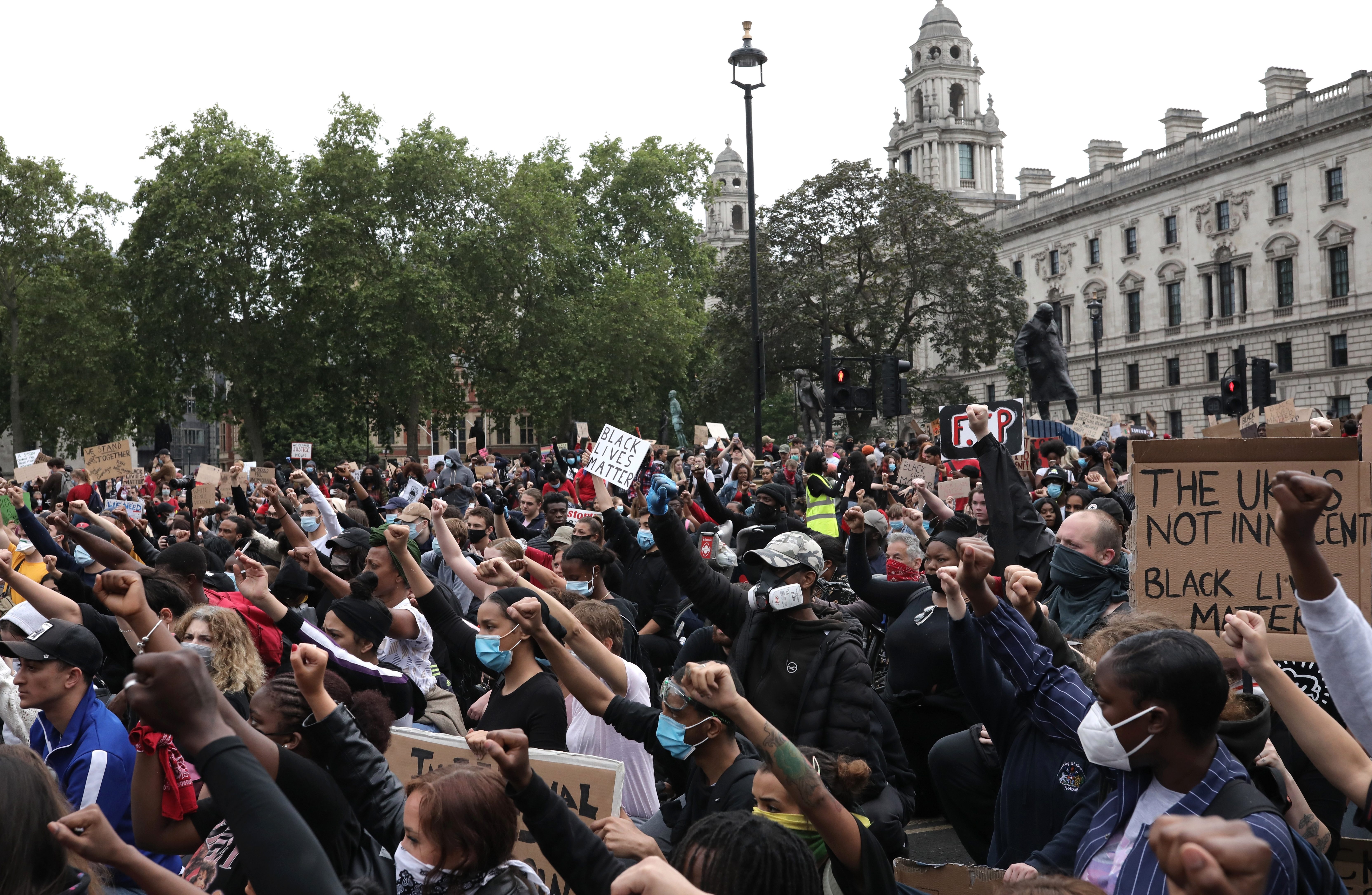  Members of the campaign group Black Lives Matter and supporters, gather outside Parliament, central London to demonstrate on Wednesday