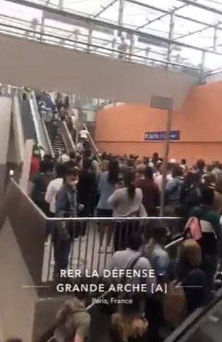 People leaving the La Défense - Grande Arche station as it is evacuated