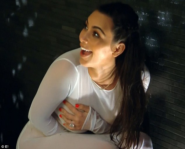 Kim was caught taking selfies in a wet white dress for her husband 