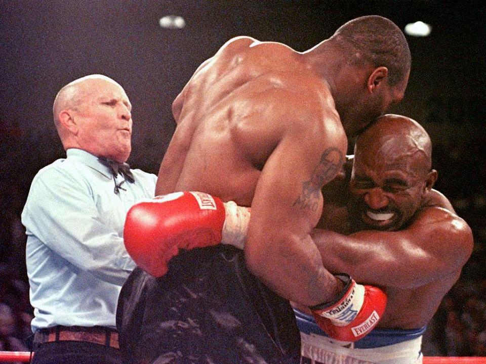 Mike Tyson biting Evander Holyfield's ear in 1997 