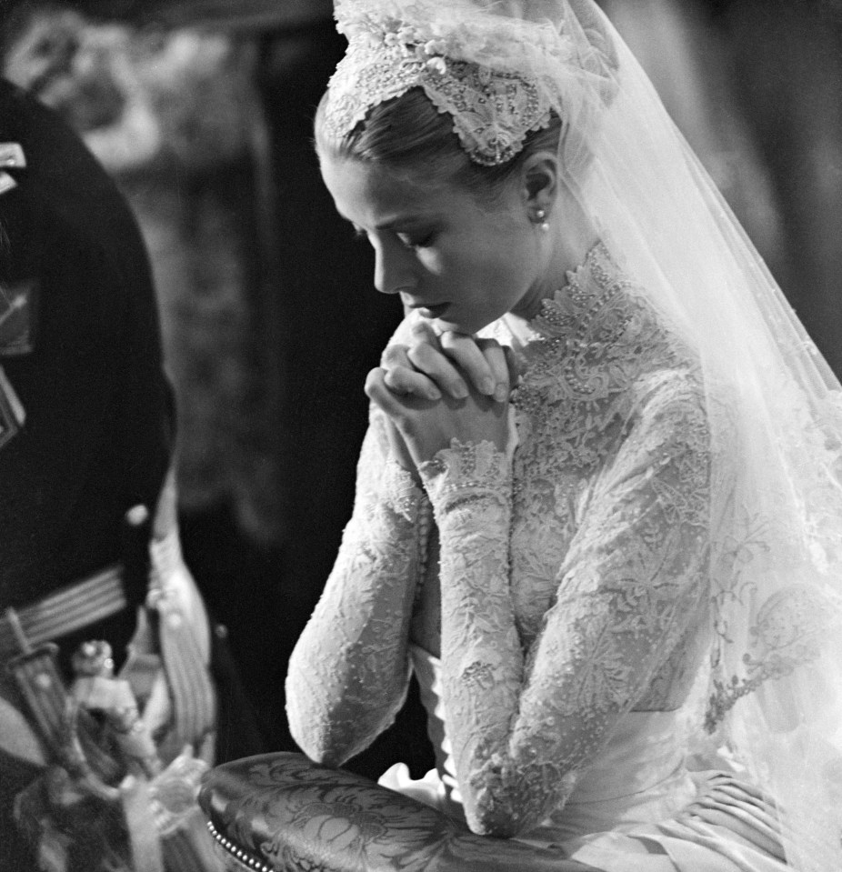 Grace Kelly prays during her wedding to Prince Rainier of Monaco on April 20, 1956