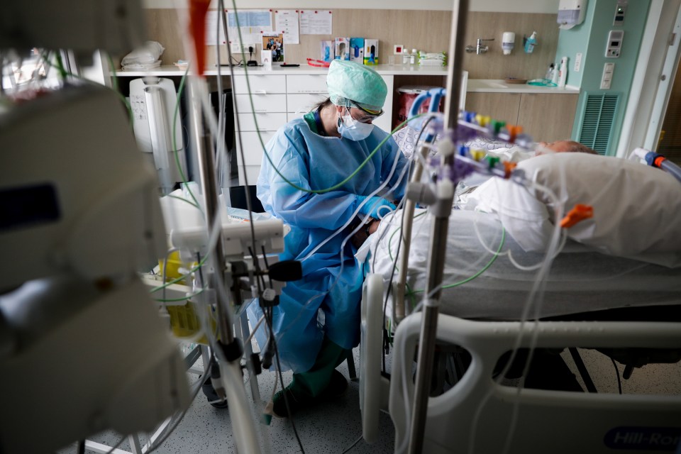 A nurse tends to a patient at a hospital in Brussels, Belgium