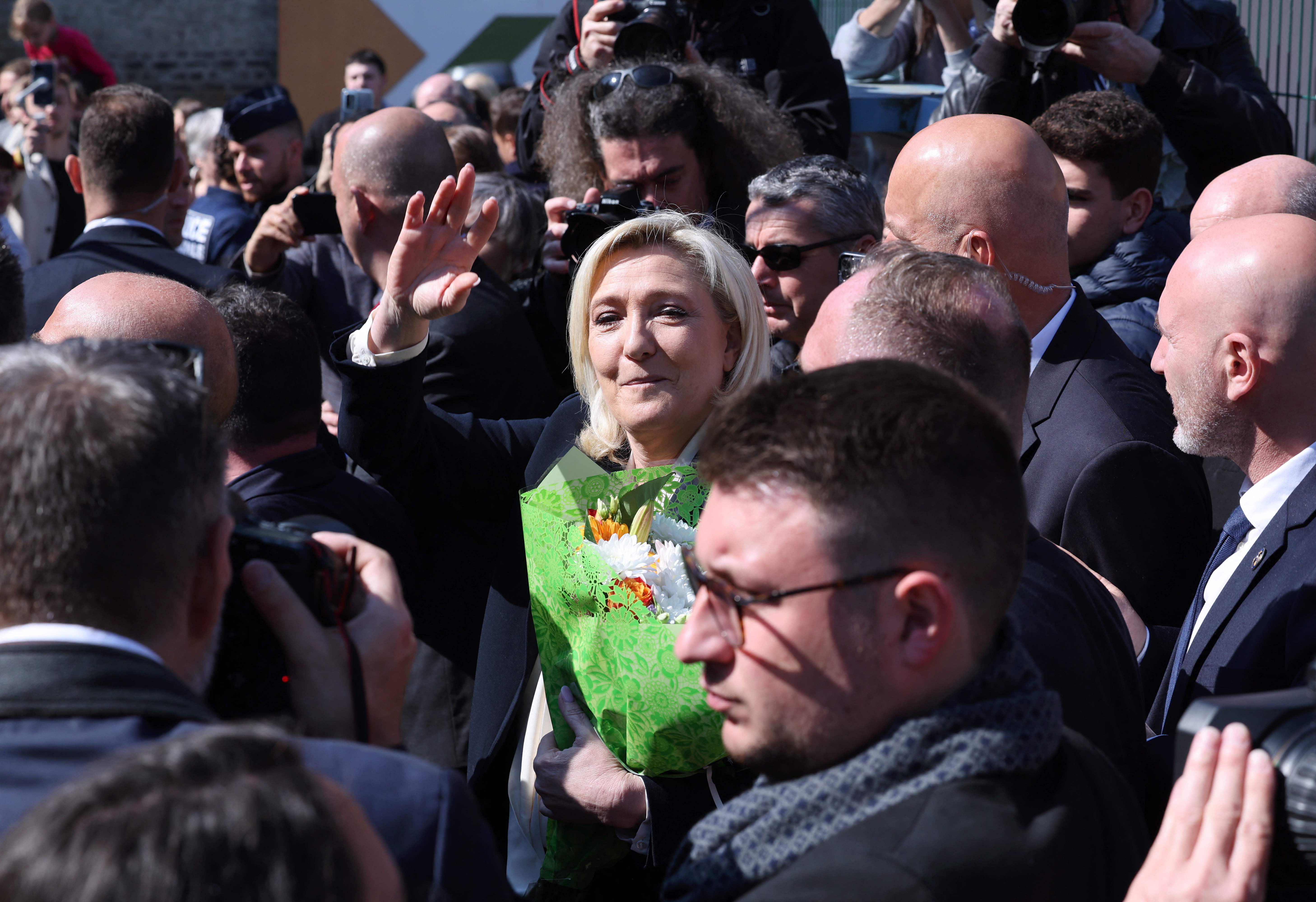 The presidential candidate Marine Le Pen waved as she left the polling station