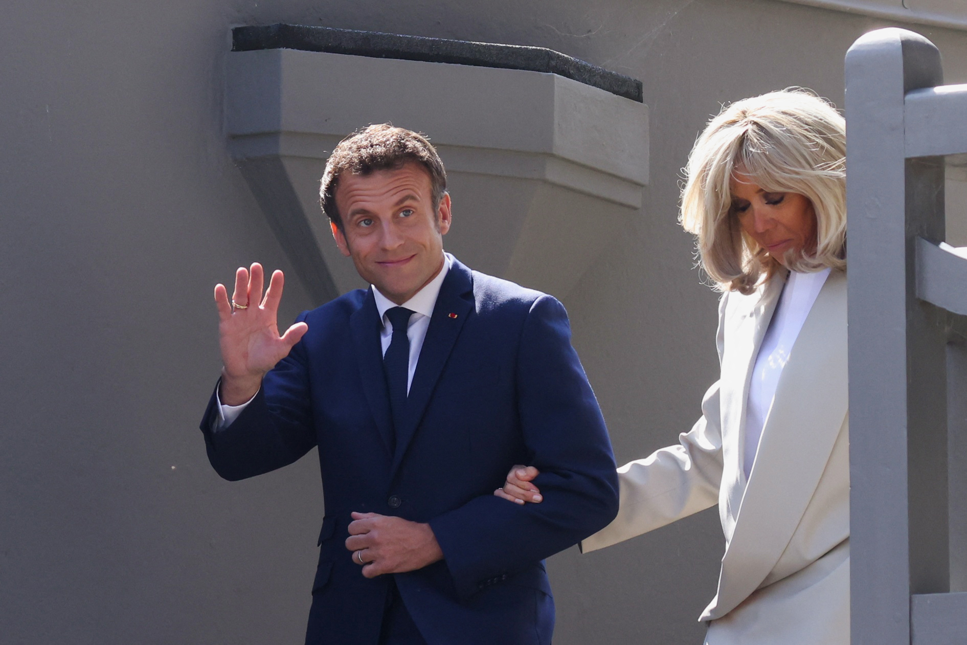 French President Emmanuel Macron, candidate for his re-election, and his wife Brigitte Macron seen leaving their home to vote