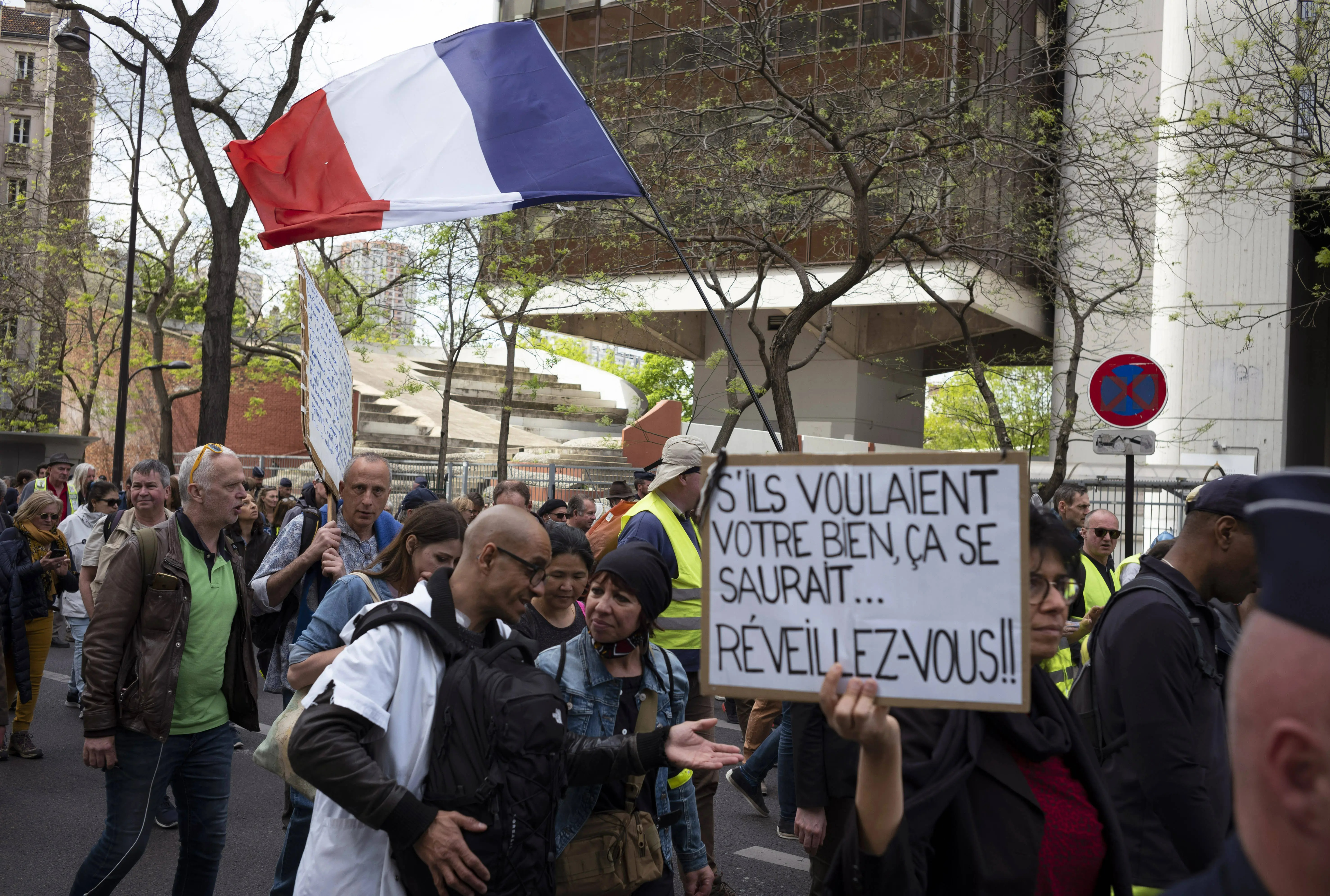 Demonstrators march during a Yellow Vests protest in Paris