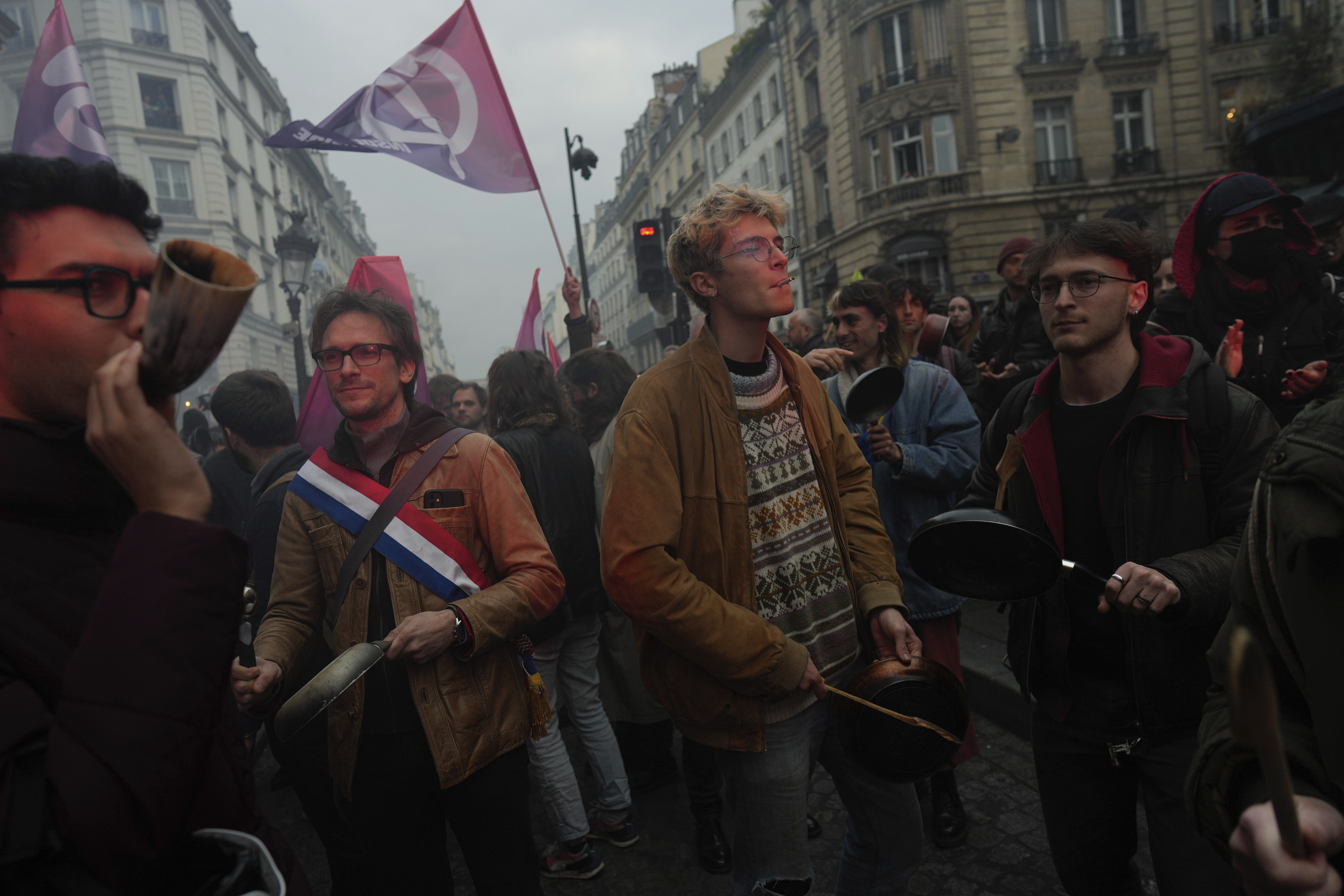 Hundreds of people took to the streets of Paris within minutes of Macron speaking to the nation in a TV address