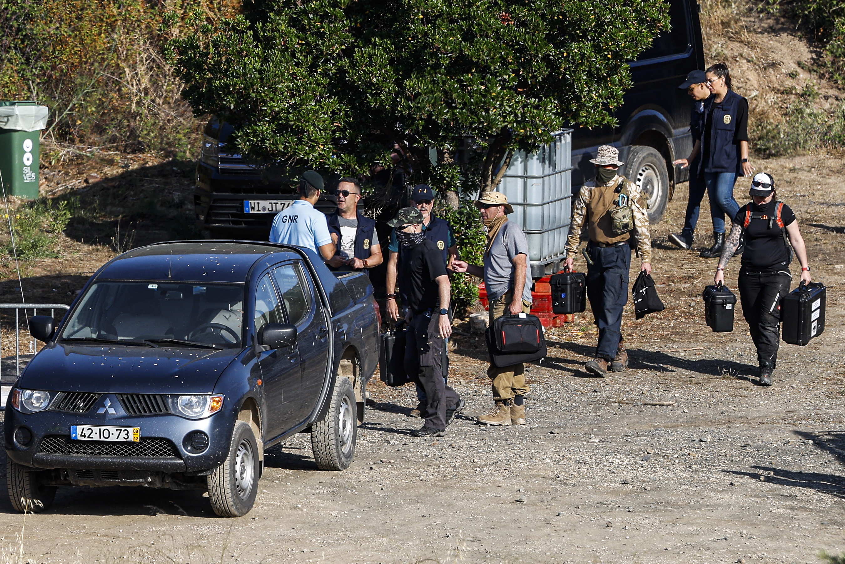 Search crews pictured arriving at the scene earlier today