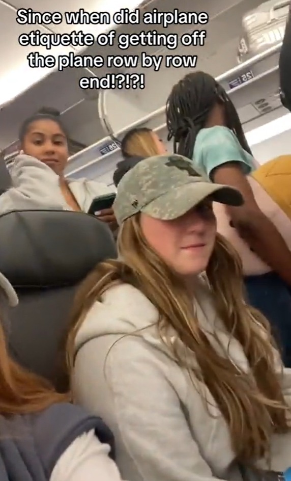 Passengers were spotted blocking the aisles