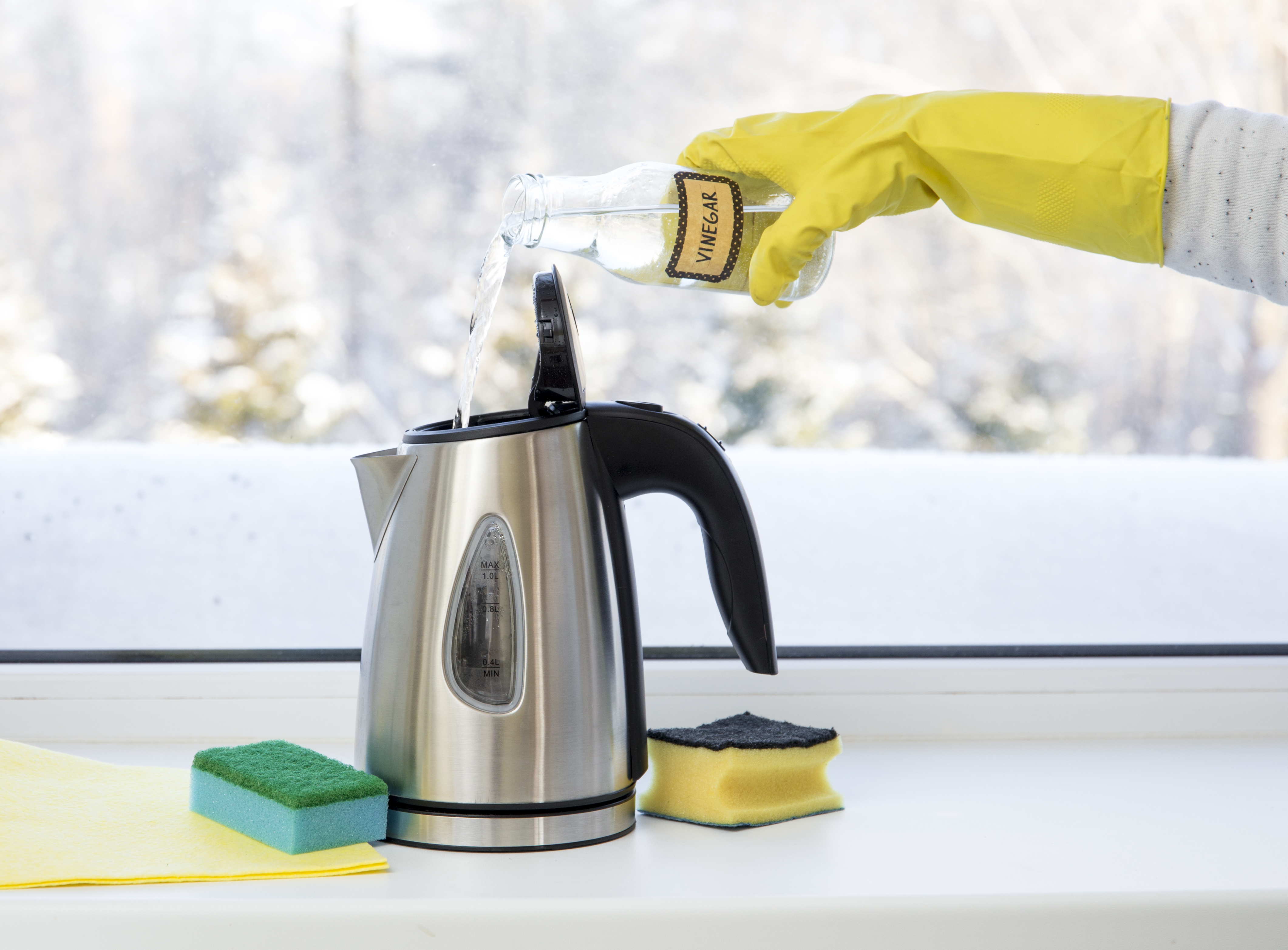 You can use bicarbonate of soda to clean your kettle