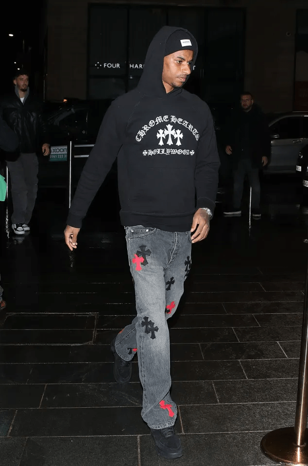 Marcus Rashford wore a hoodie and jeans