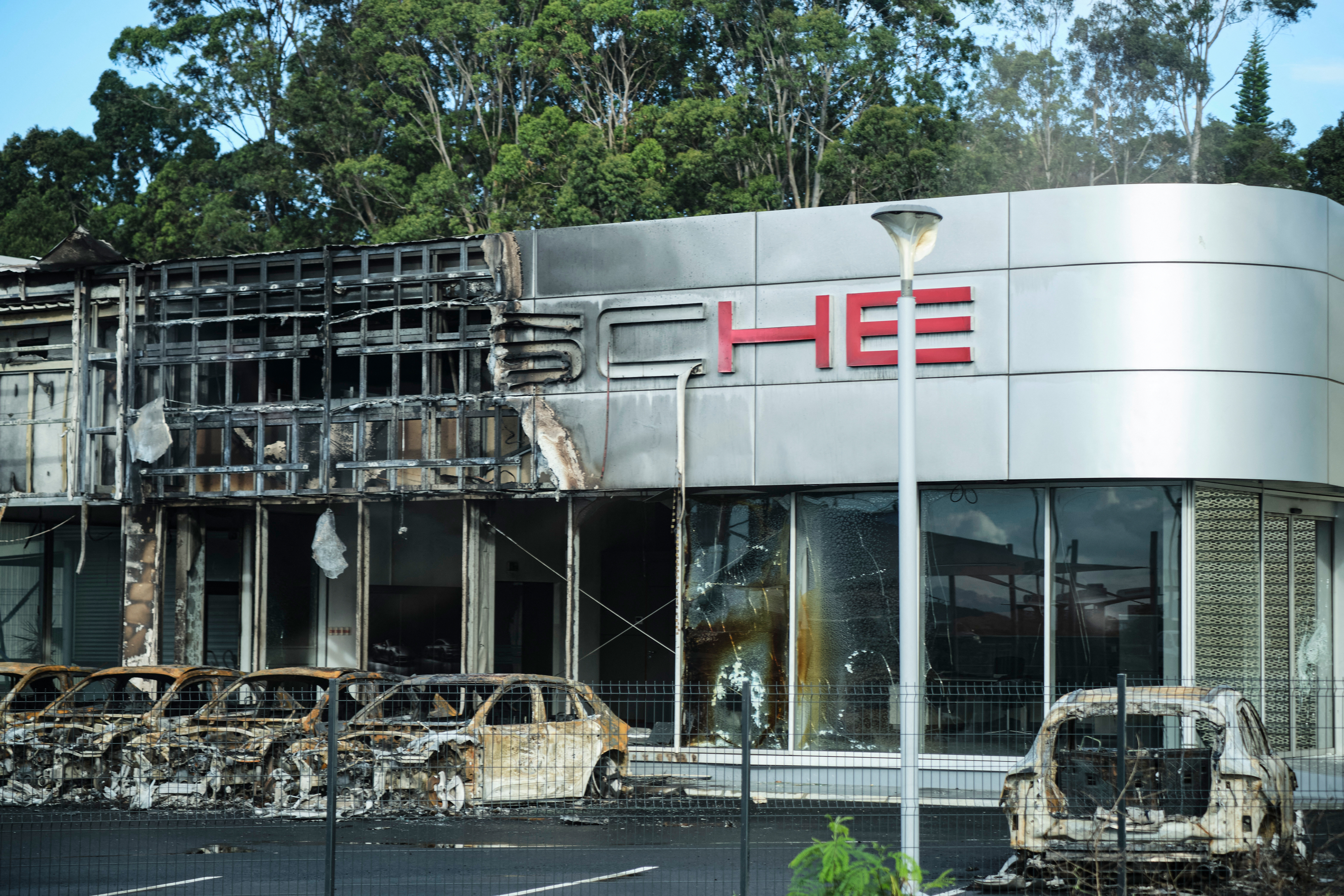 A car dealer store is destroyed in the Magenta district of Noumea