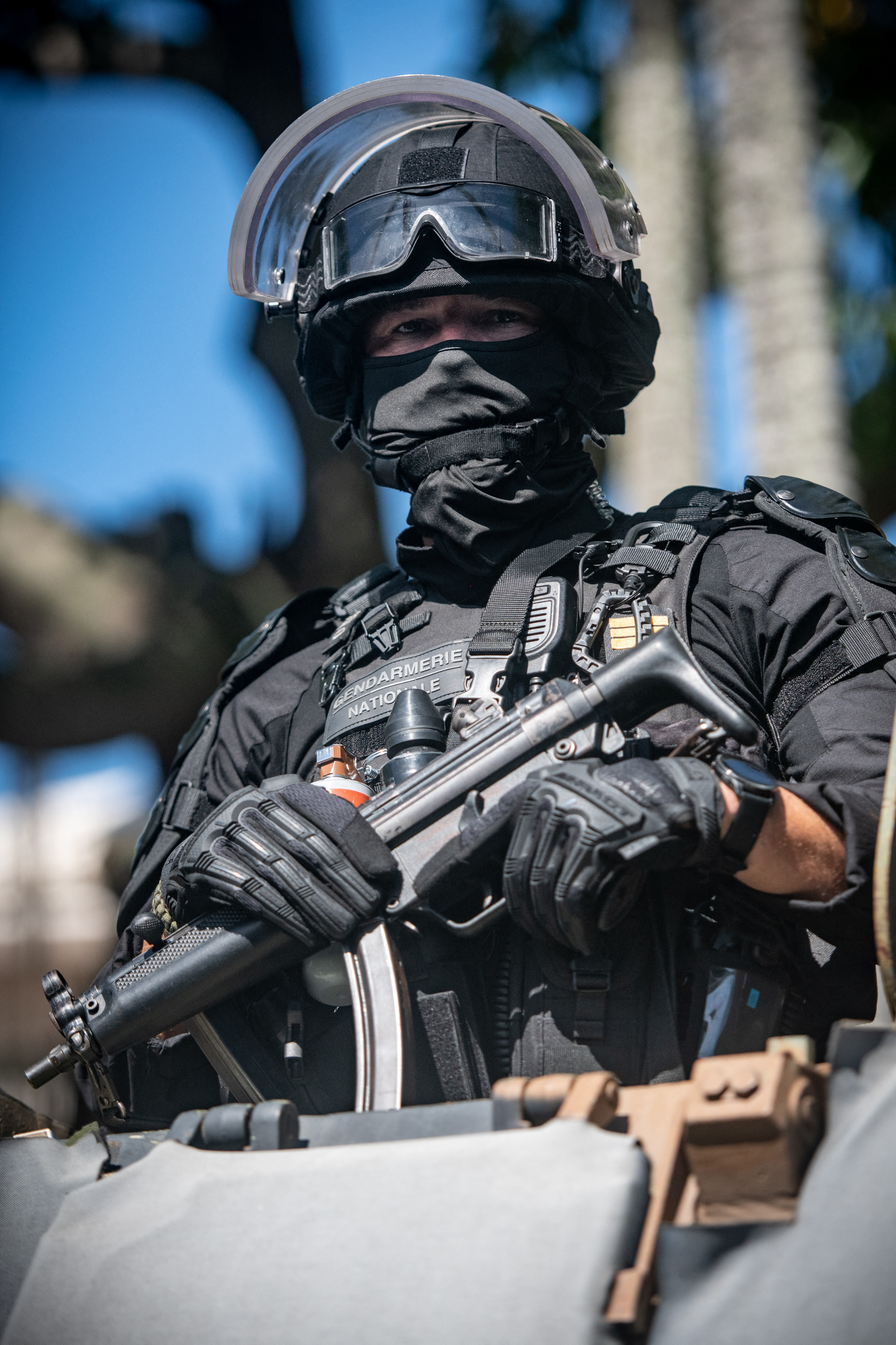 A Gendarmerie officer looks on from an armoured vehicle in Noumea, New Caledonia