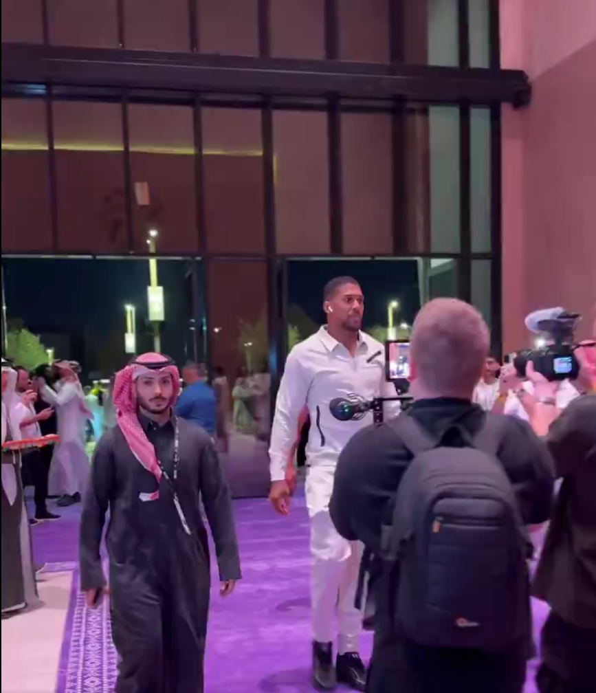 AJ was spotted arriving wearing a white top and matching trousers in Riyadh