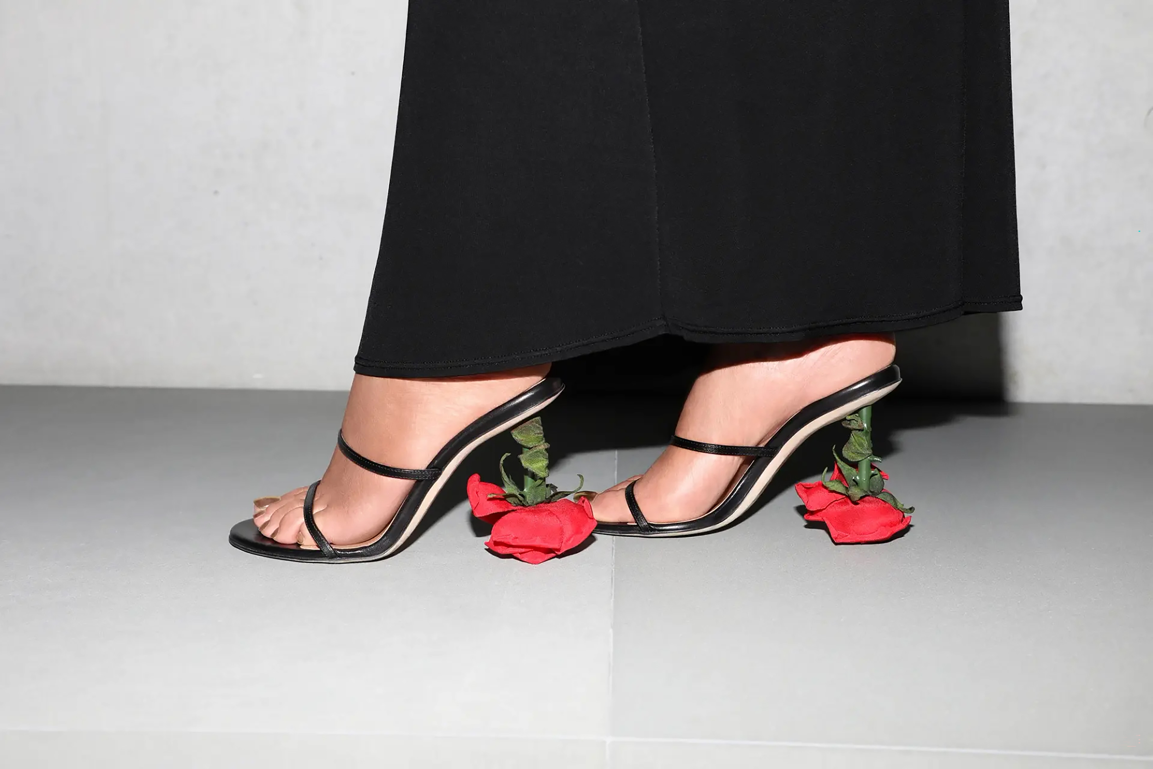 The singer wore a pair of shoes supported by an inverted red rose heel