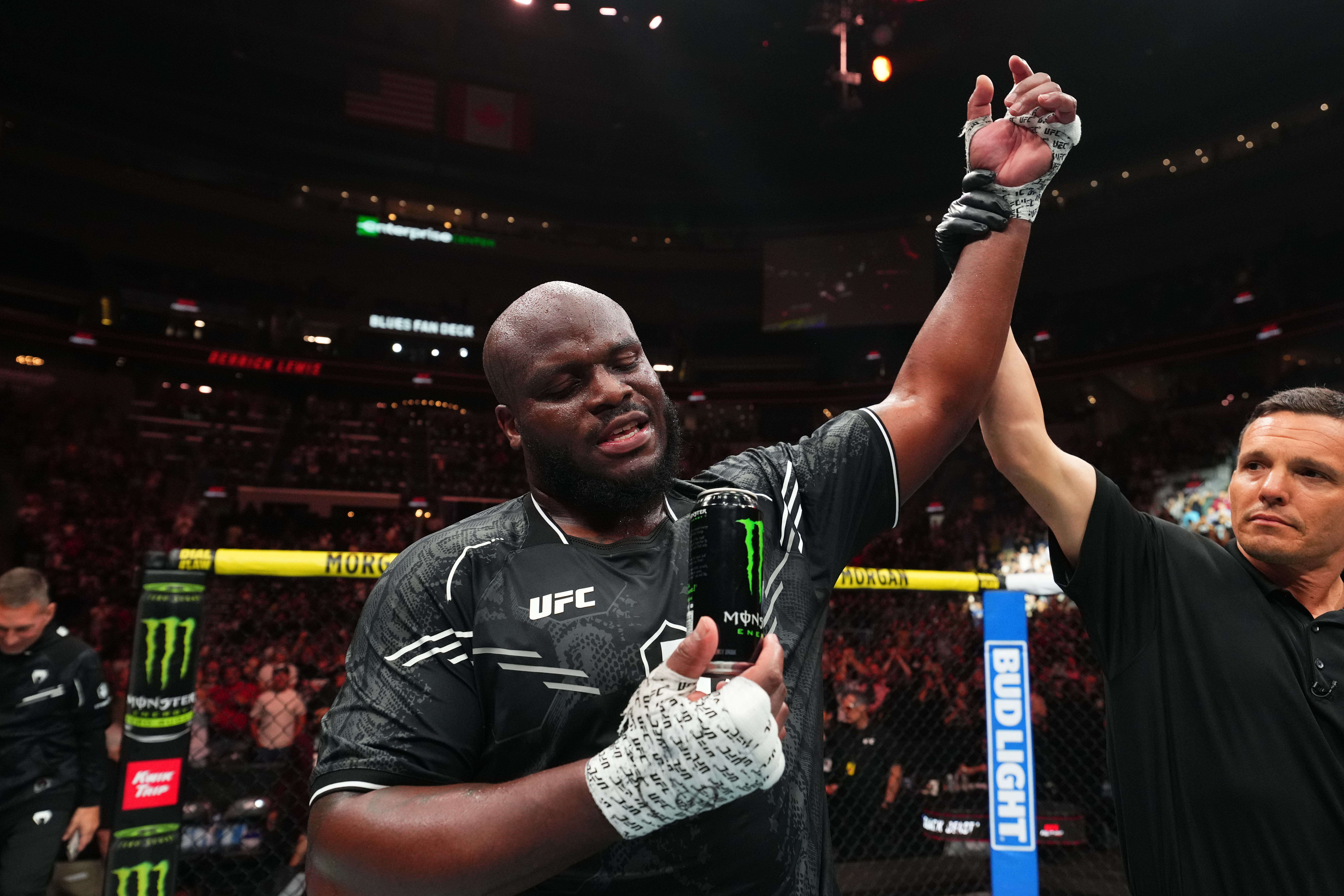 Derrick Lewis celebrates extending his record for the most knockouts in UFC history