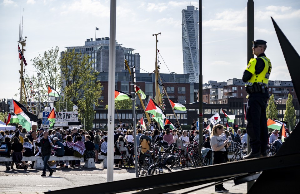 Thousands of anti-Israeli protesters have marched through Malmo holding up signs and chanting as they campaign against Israel's inclusion in the contest