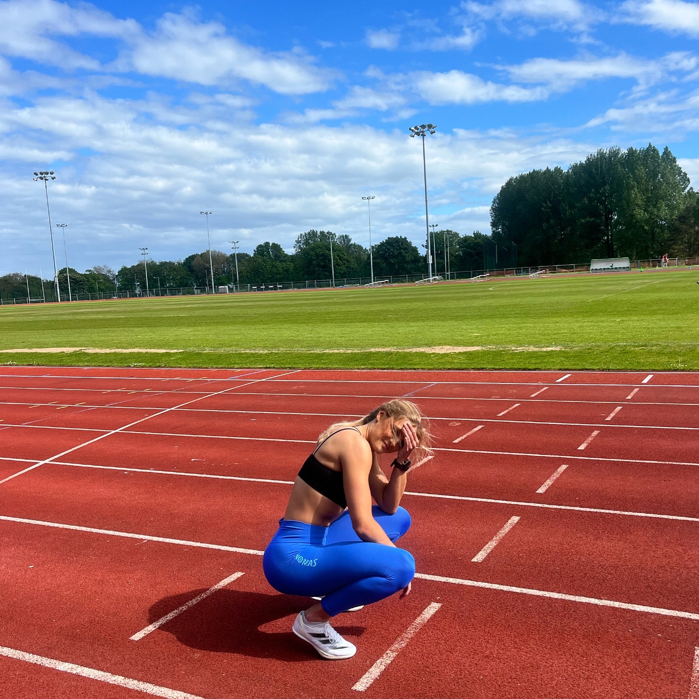 She also posed on the running track