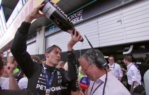 Moment Russell pours champagne all over reporter then refuses interview