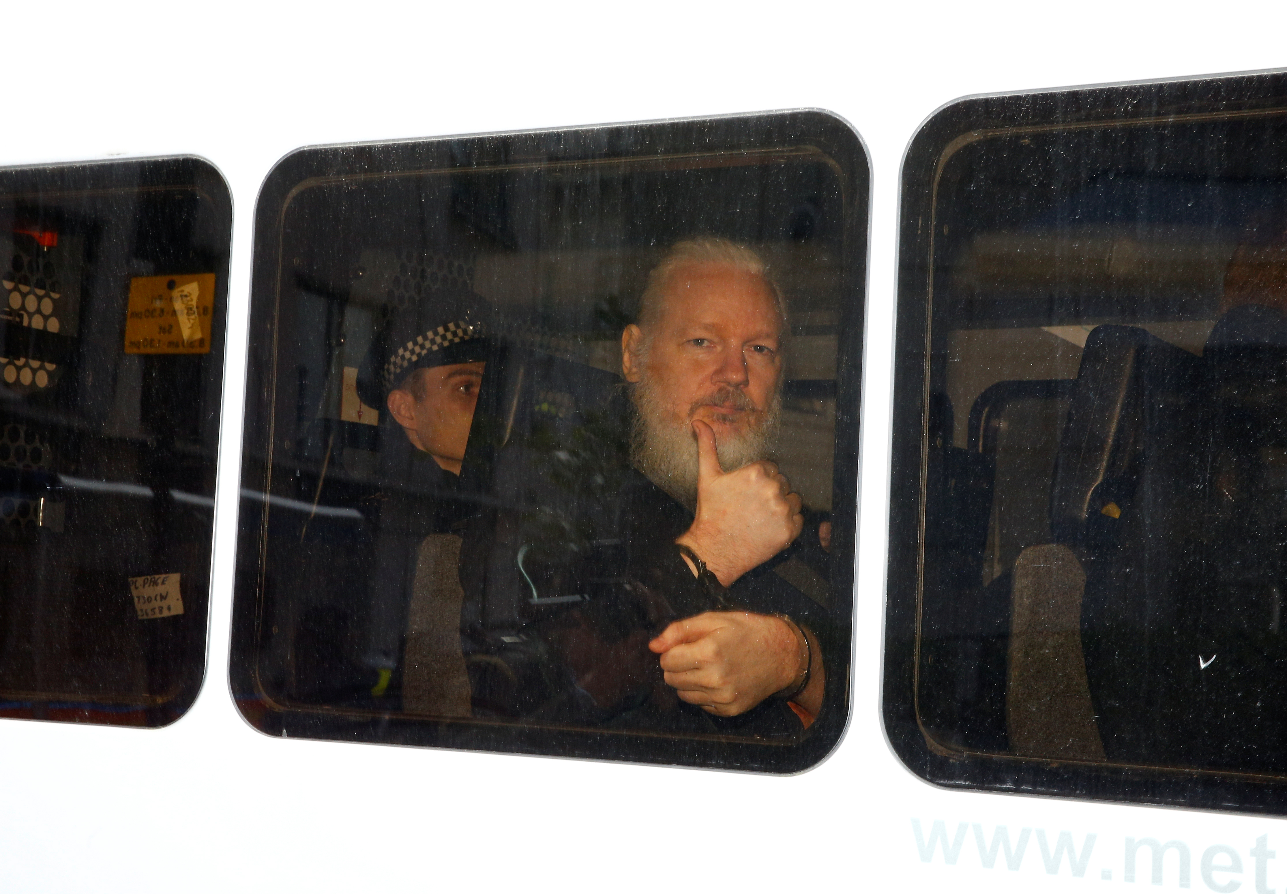 The Wikileaks founder in a cop van in London in April 2019, when he was arrested by the Met and taken to Belmarsh