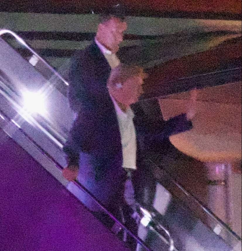 Trump was pictured getting off his plane early Sunday at Newark Airport hours after the shooting