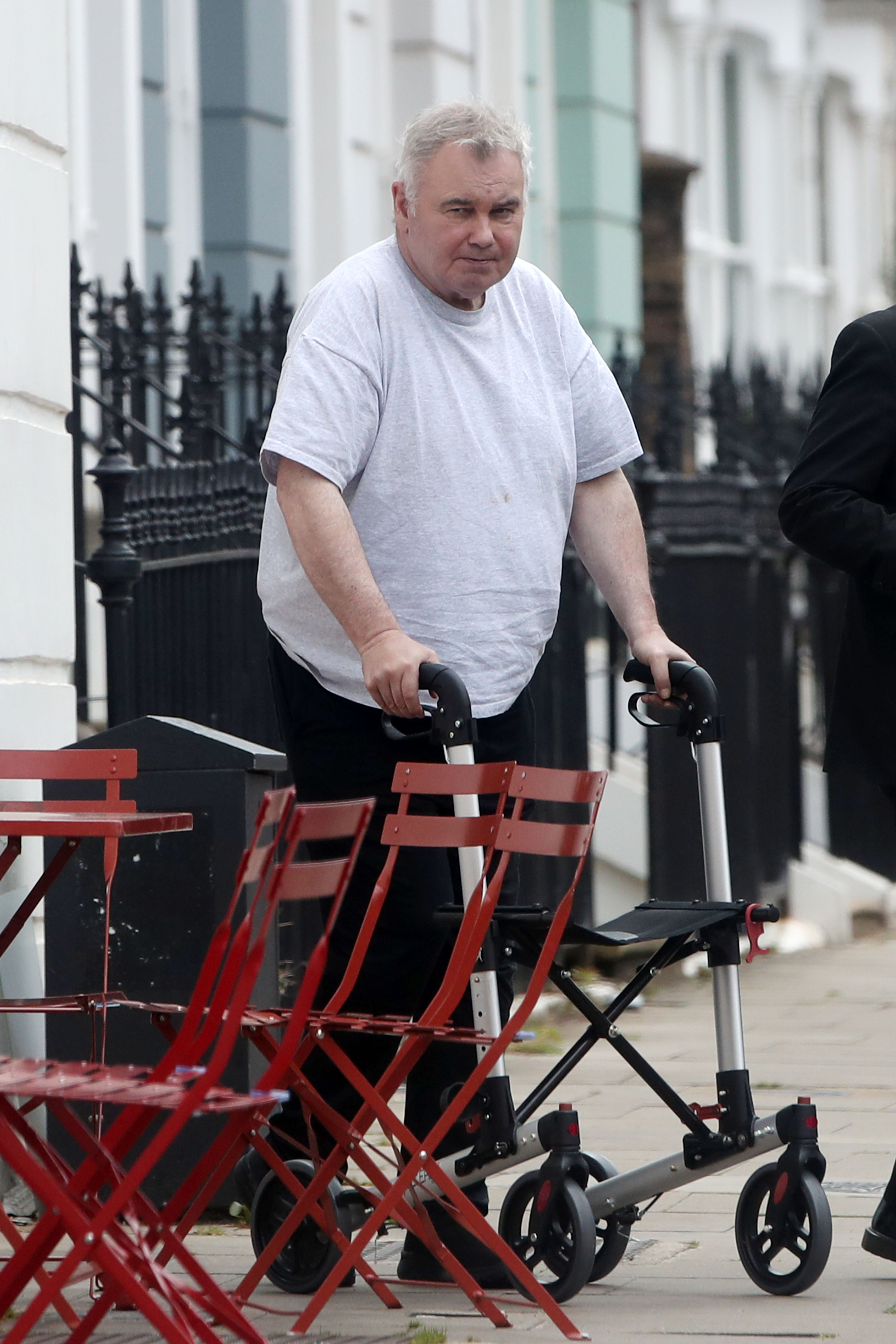 The TV star appeared to struggle to walk and was using his walking frame