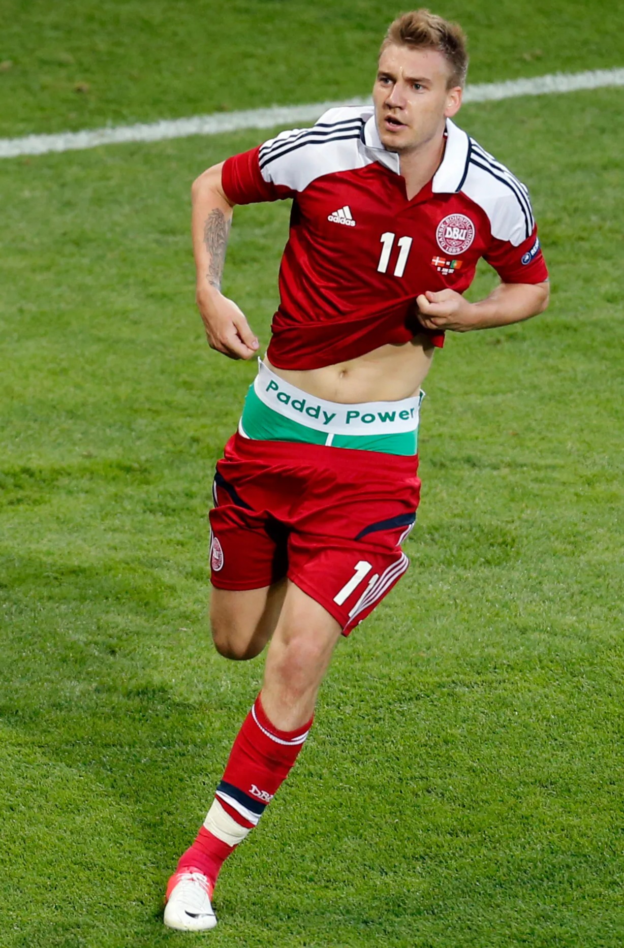 Nicklas Bendtner was punished for 'ambush marketing' when he showed off his Paddy Power pants after scoring for Denmark at Euro 2012