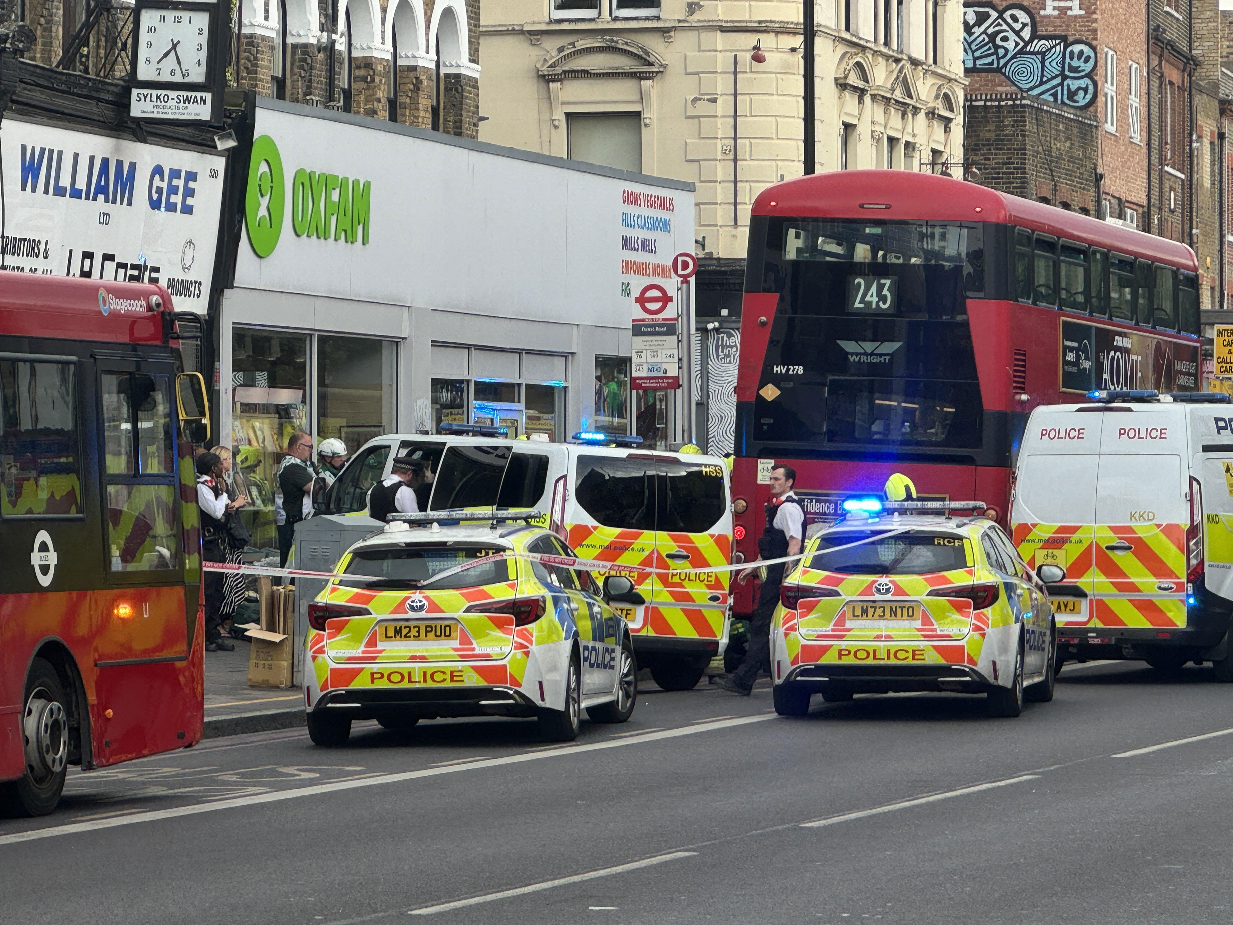 A man was trapped underneath a double decker bus this evening as cops desperately raced to free him