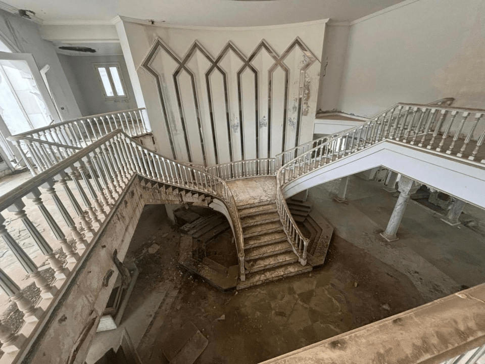 The once sparkling marble stairs now destroyed and crumbling