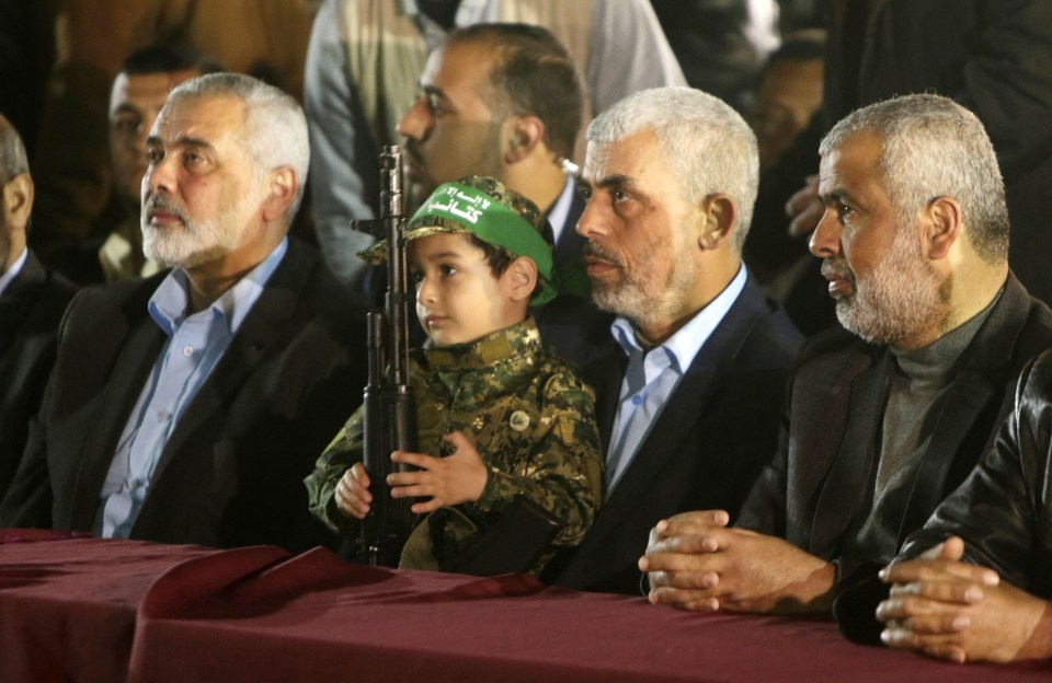 Yahya Sinwar (2nd R), the leader of the Hamas Islamist movement with Haniyeh (L)