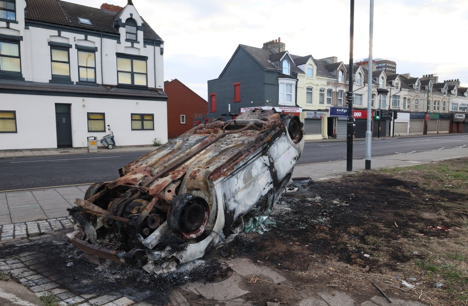 A torched upside-down car in Middlesbrough this morning