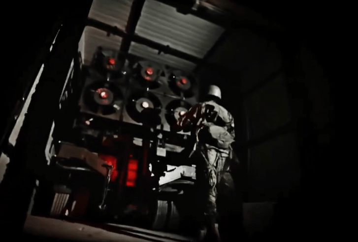 A Hezbollah terrorist unloading the missile-packed truck