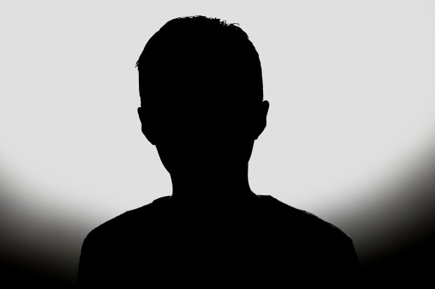 a silhouette of a person 's head with a white background