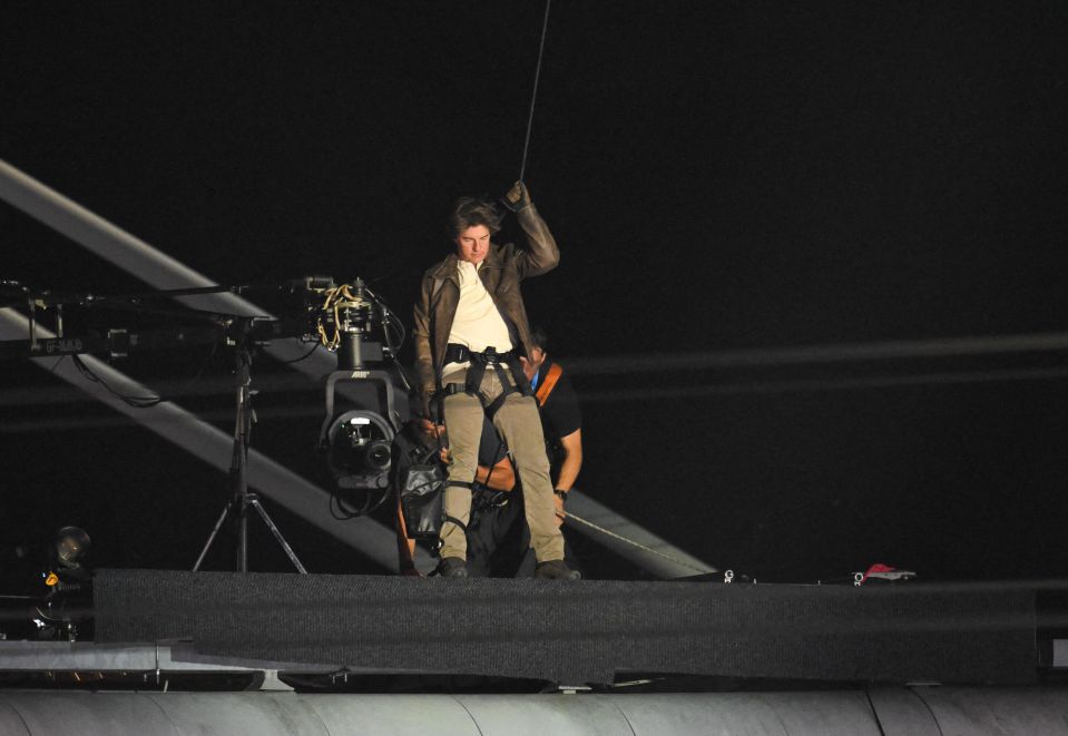 Tom Cruise was seen standing at the top of the stadium before his stunt