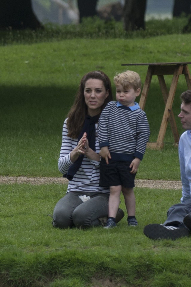 Kate wearing stripes and a young Prince George at Houghton Horse Trials, 2016.