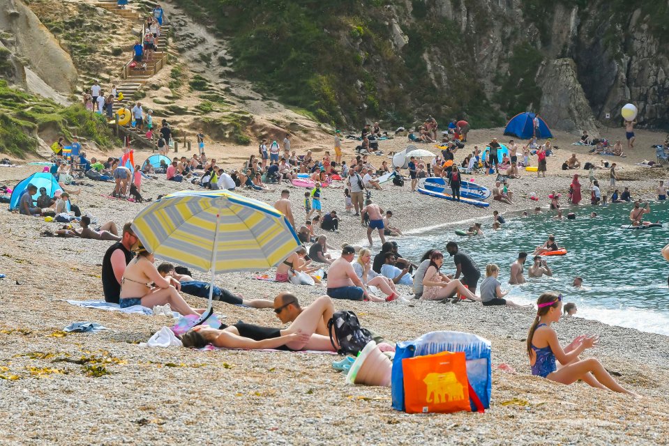 Durdle Door in Dorset was also a popular place to soak up the sun today