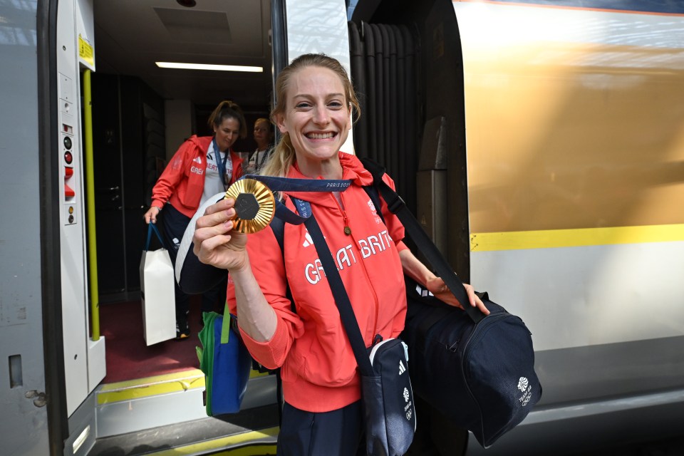 Bryony Page proudly displays her gold medal