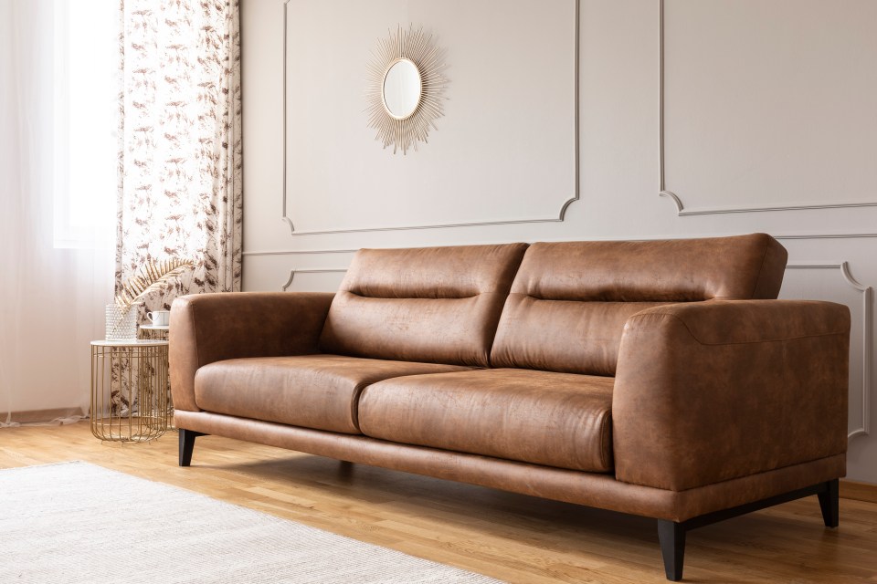 According to Loren Kreiss, leather sofas are "sticky, slippery and plain ugly'