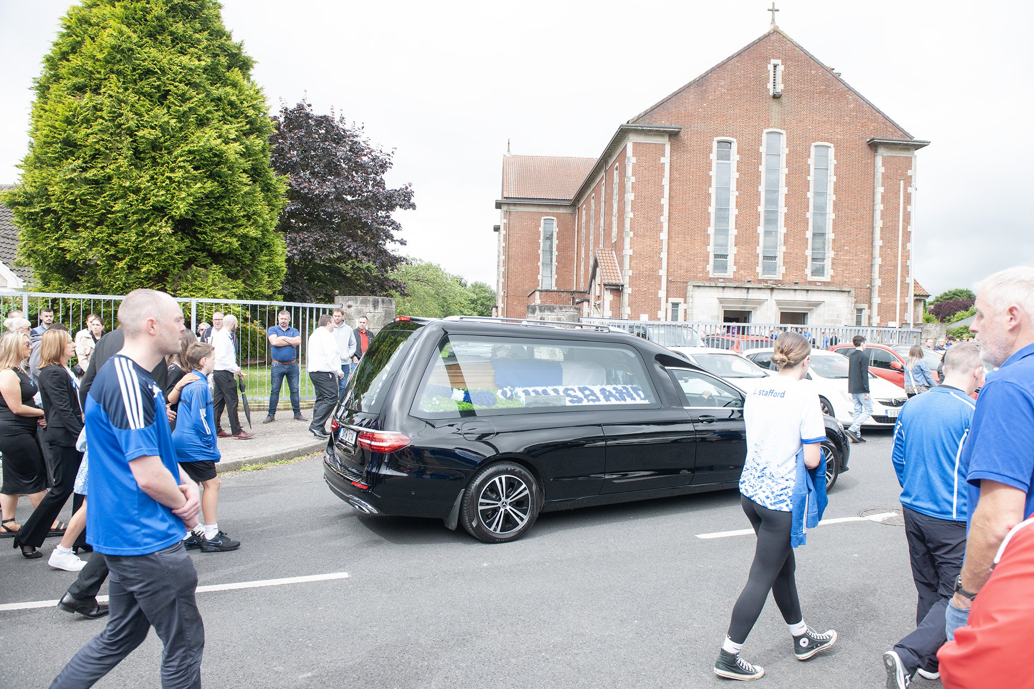 The funeral of the late Michael Grant arriving at the Holy Family Church