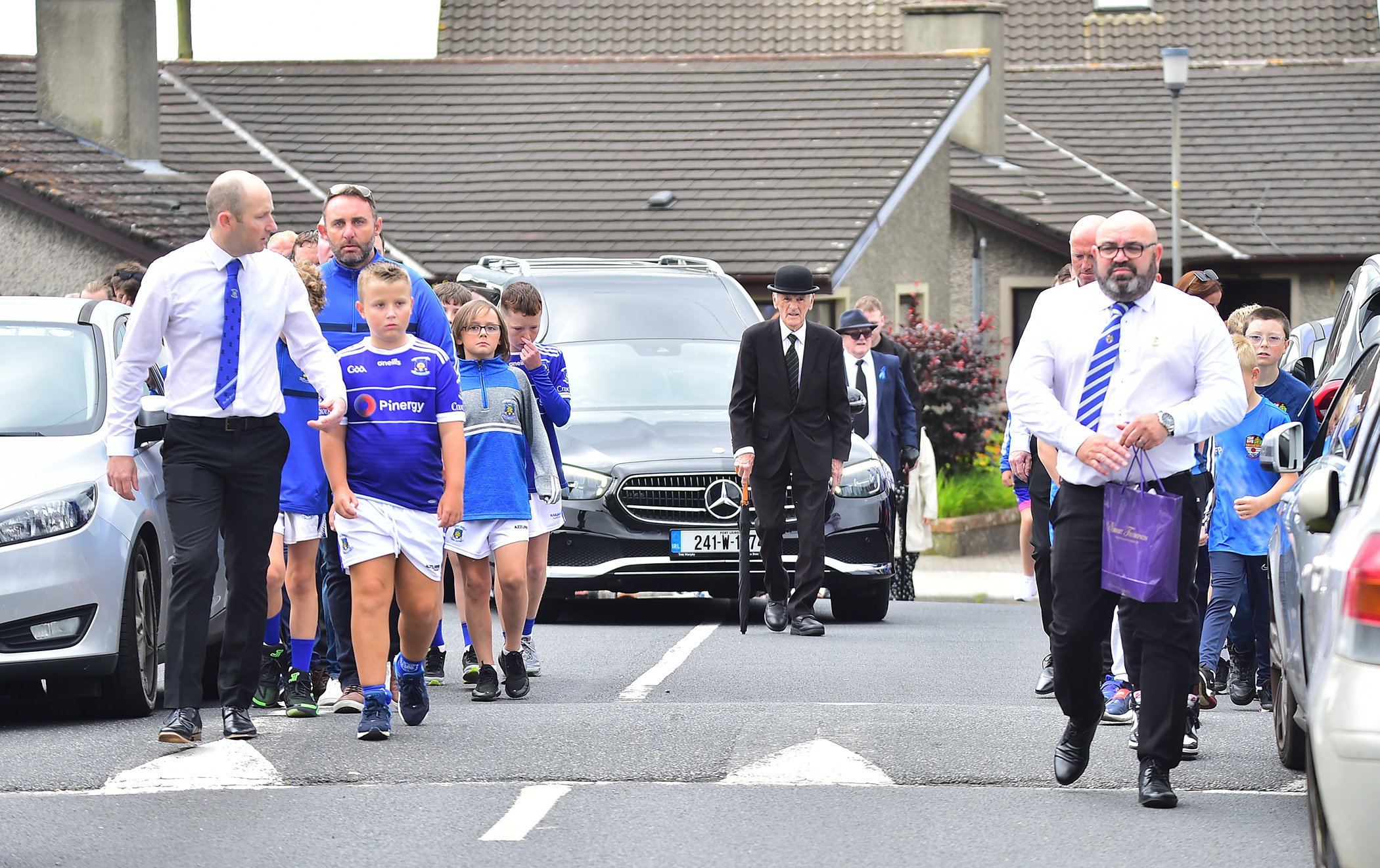 Players from Mount Sions with a guard of honour at the funeral of the late Michael Grant