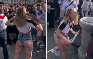 Female fan flashes big crowd of England supporters then gets handshake from man