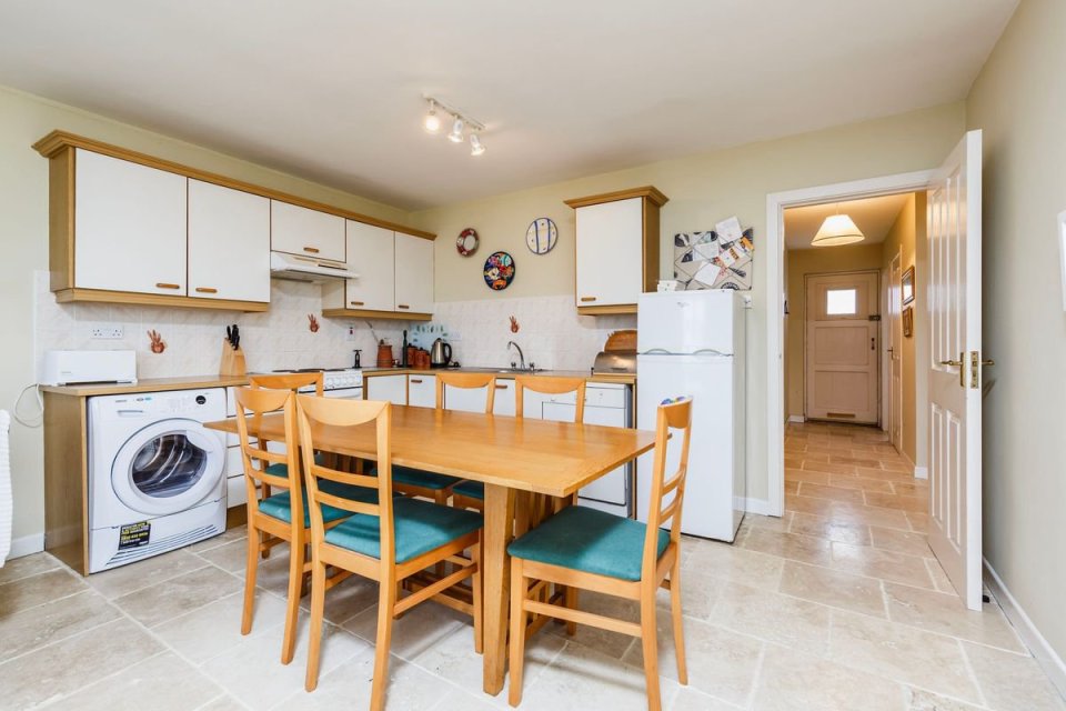 The kitchen has gorgeous built-in units