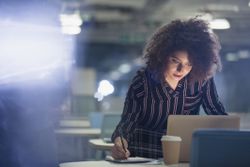 Focused businesswoman working late