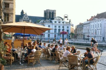 People in street cafes, Graslei, Gent, Flanders, Belgium, Europe