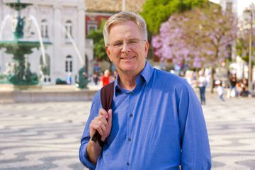 Rick Steves in Rossio Square in Lisbon, Portugal while filming Rick Steves' Europe