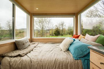 The bed inside The Glass House: A Hudson Valley Tiny Home Escape