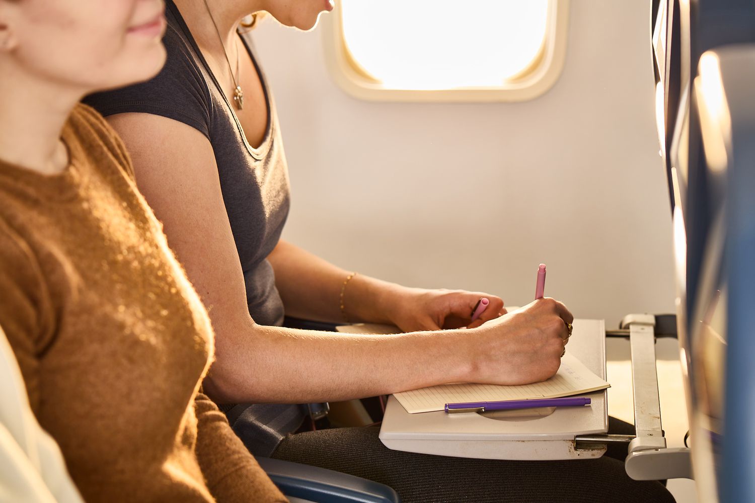 A person sketching on a notepad